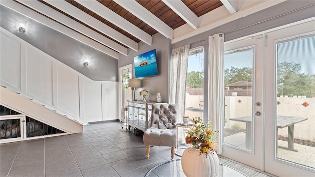 interior space featuring wooden ceiling, beam ceiling, high vaulted ceiling, tile patterned floors, and french doors