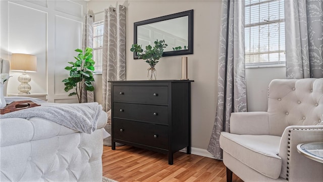 sitting room with hardwood / wood-style flooring