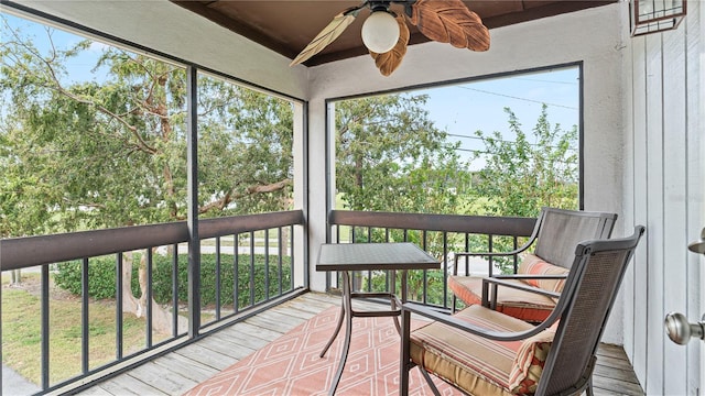 sunroom featuring plenty of natural light and ceiling fan