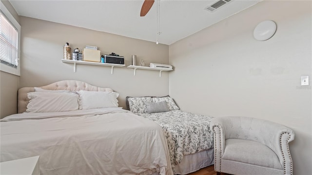 bedroom featuring hardwood / wood-style flooring and ceiling fan