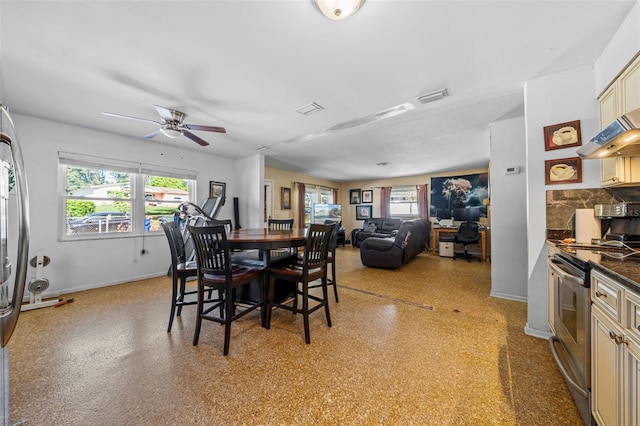 dining area featuring ceiling fan and a healthy amount of sunlight