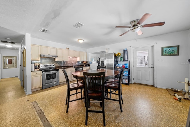 dining area featuring a textured ceiling, ceiling fan, and sink