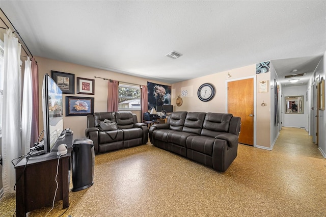 living room featuring a textured ceiling