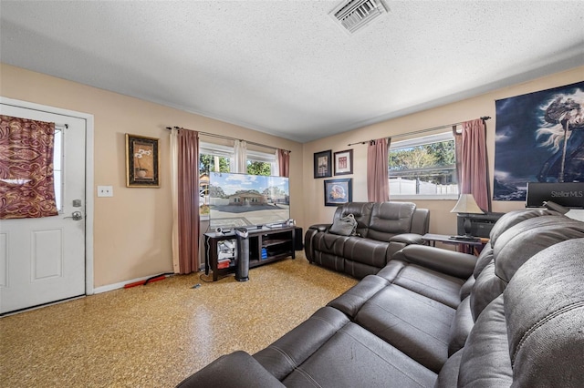 living room with a textured ceiling