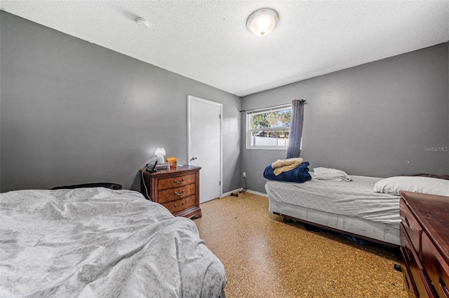 bedroom featuring a textured ceiling