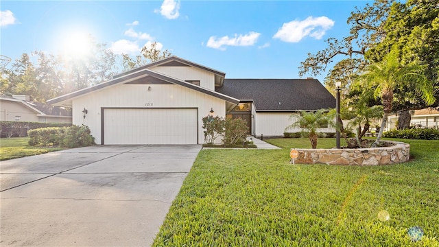 view of front of home featuring a garage and a front lawn