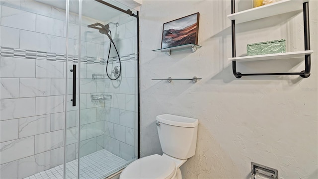 bathroom featuring walk in shower and toilet