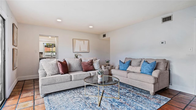 living room with tile patterned flooring