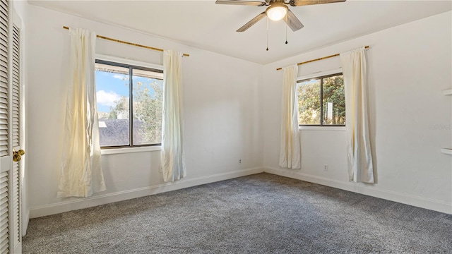 carpeted empty room with ceiling fan