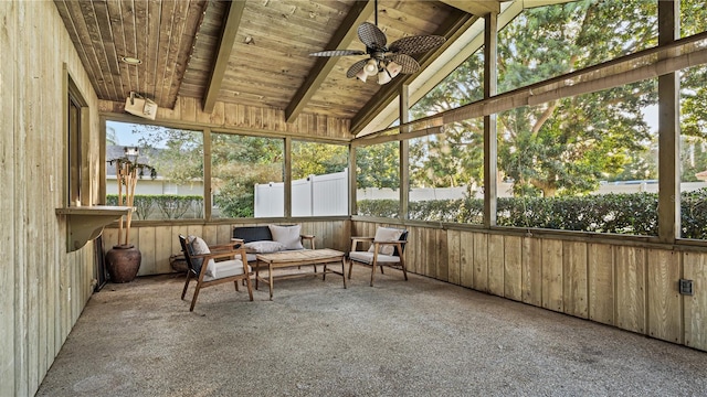 unfurnished sunroom with vaulted ceiling with beams, ceiling fan, and wooden ceiling