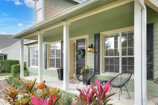 property entrance featuring covered porch