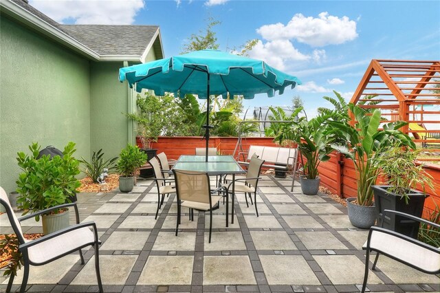 1935 Austin Ter, Winter Haven, FL 33884 - view of patio / terrace featuring outdoor dining area and fence