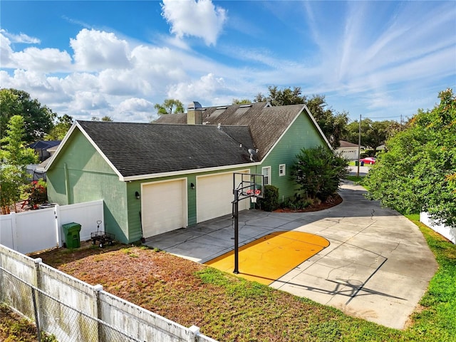 1935 Austin Ter, Winter Haven, FL 33884 - view of home's exterior with a shingled roof, fence, a chimney, and basketball hoop