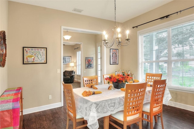 1935 Austin Ter, Winter Haven, FL 33884 - dining room with an inviting chandelier, baseboards, visible vents, and dark wood finished floors