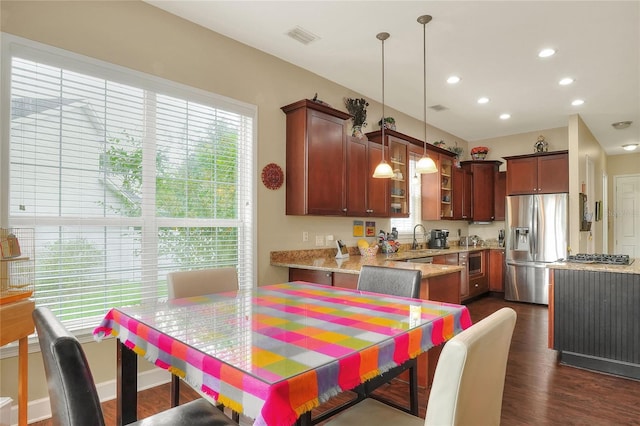 1935 Austin Ter, Winter Haven, FL 33884 - kitchen with pendant lighting, recessed lighting, dark wood-style flooring, light stone counters, and appliances with stainless steel finishes