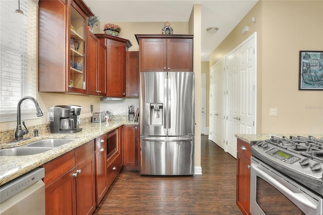1935 Austin Ter, Winter Haven, FL 33884 - kitchen featuring dark wood-style flooring, light stone counters, stainless steel appliances, and a sink