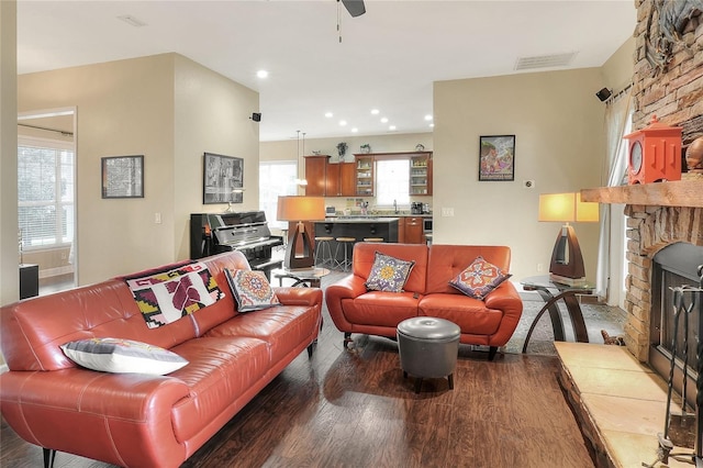 1935 Austin Ter, Winter Haven, FL 33884 - living area featuring recessed lighting, a stone fireplace, visible vents, and wood finished floors
