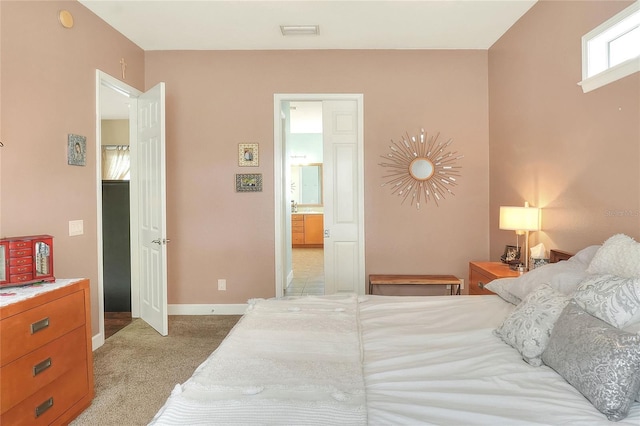 1935 Austin Ter, Winter Haven, FL 33884 - bedroom with baseboards, light carpet, and visible vents