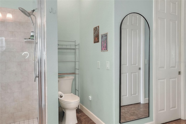 1935 Austin Ter, Winter Haven, FL 33884 - full bathroom with a shower stall, baseboards, tile patterned floors, and toilet