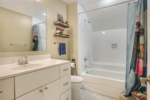 1935 Austin Ter, Winter Haven, FL 33884 - bathroom featuring toilet, shower / tub combo with curtain, tile patterned floors, vaulted ceiling, and vanity