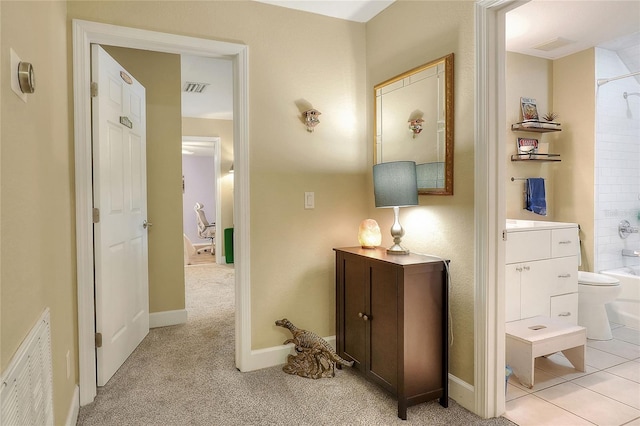 1935 Austin Ter, Winter Haven, FL 33884 - hallway featuring visible vents, baseboards, and light carpet