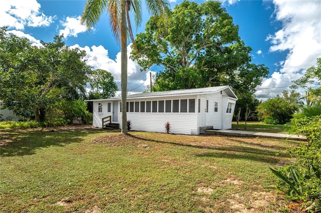 exterior space with a front lawn