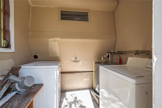 clothes washing area with washer and dryer