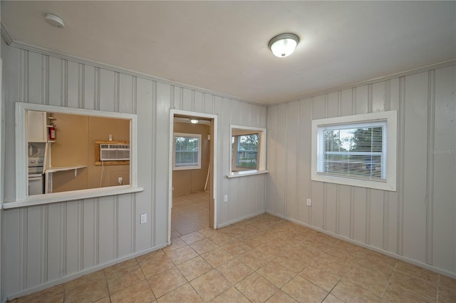 tiled empty room with an AC wall unit