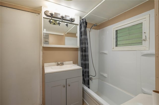 bathroom featuring vanity and shower / bath combination with curtain