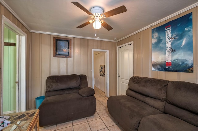 tiled living room featuring crown molding and ceiling fan