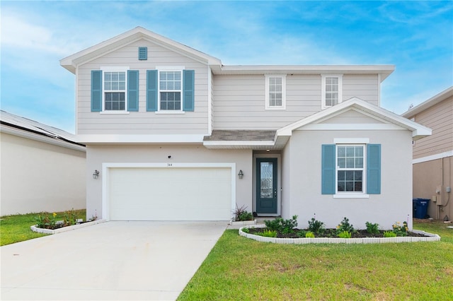 view of property featuring a garage and a front lawn