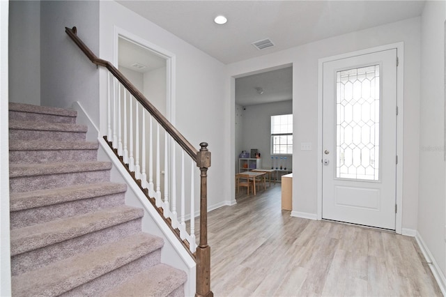 entrance foyer with light hardwood / wood-style floors