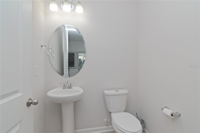 bathroom featuring sink and toilet