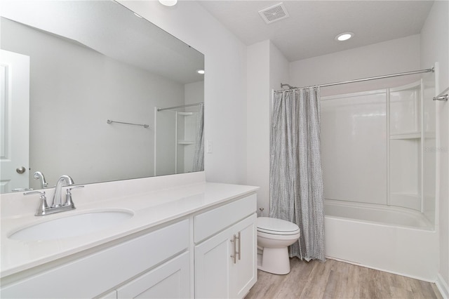 full bathroom featuring toilet, shower / bath combo, vanity, and wood-type flooring