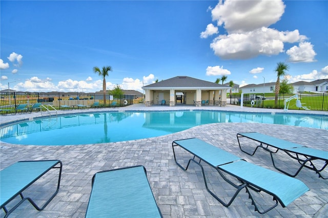 view of swimming pool with a patio area