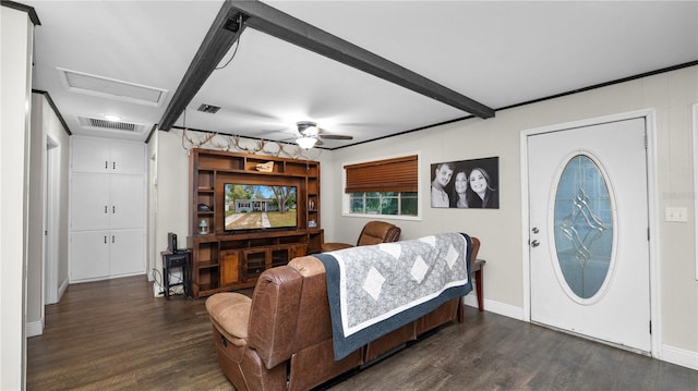 living room featuring dark wood-type flooring, beamed ceiling, and ceiling fan