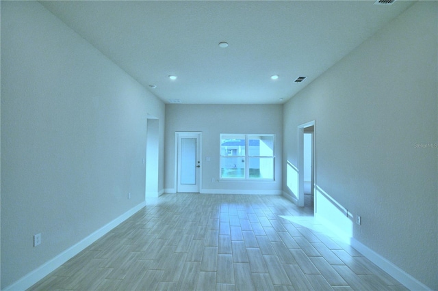 unfurnished room with light hardwood / wood-style flooring