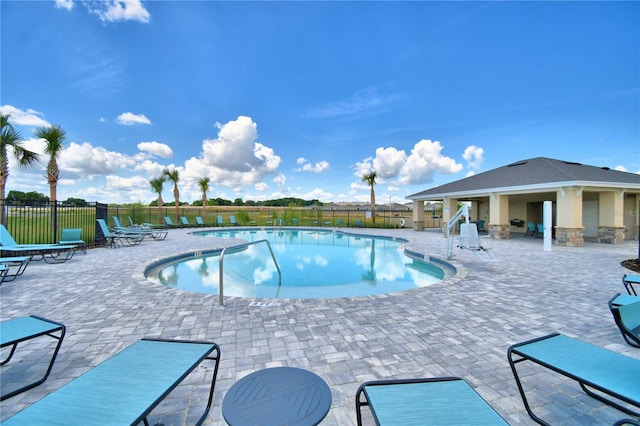 view of swimming pool with a patio area