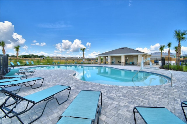 view of swimming pool featuring a patio