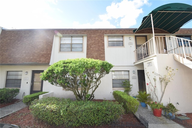 view of property with a balcony