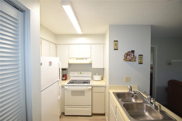 kitchen with a textured ceiling, white appliances, sink, and white cabinets