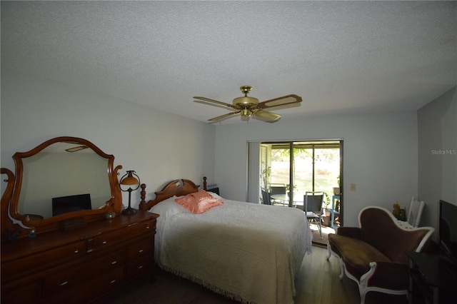 bedroom featuring a textured ceiling, hardwood / wood-style floors, ceiling fan, and access to exterior