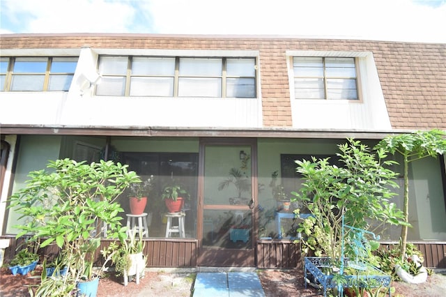 exterior space featuring a sunroom