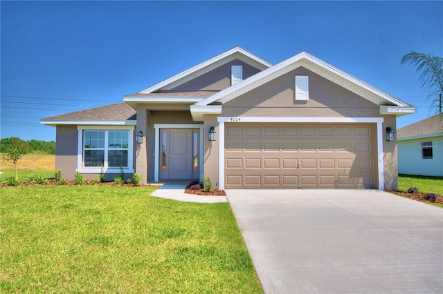 view of front of house with a garage and a front yard