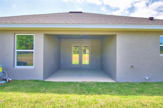 property entrance featuring a yard and a patio area