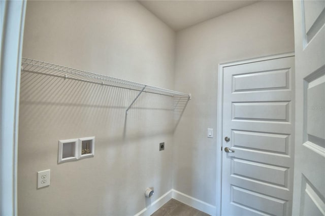 clothes washing area with baseboards, laundry area, dark wood-style floors, electric dryer hookup, and hookup for a washing machine