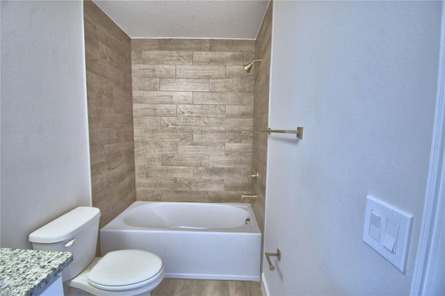 full bath featuring toilet, wood finished floors, tub / shower combination, and vanity
