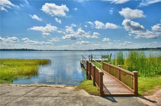 dock area featuring a water view