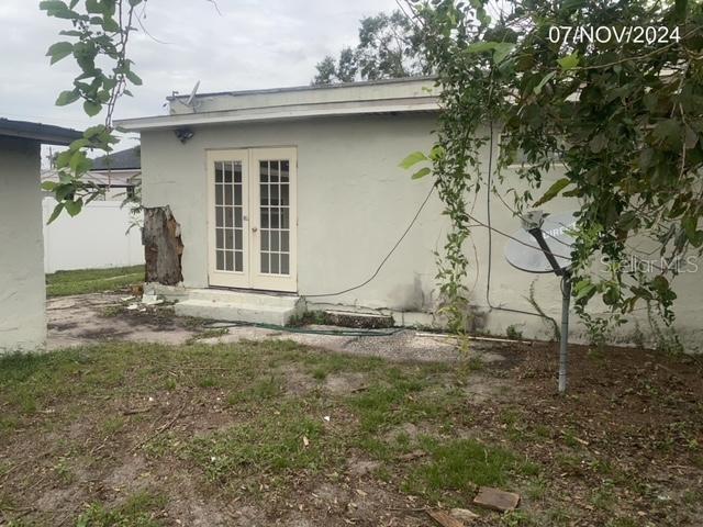 view of side of property featuring french doors