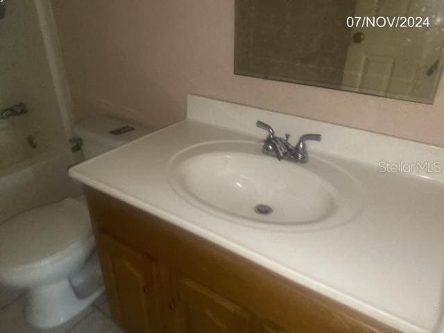 full bathroom featuring vanity, toilet, and tub / shower combination